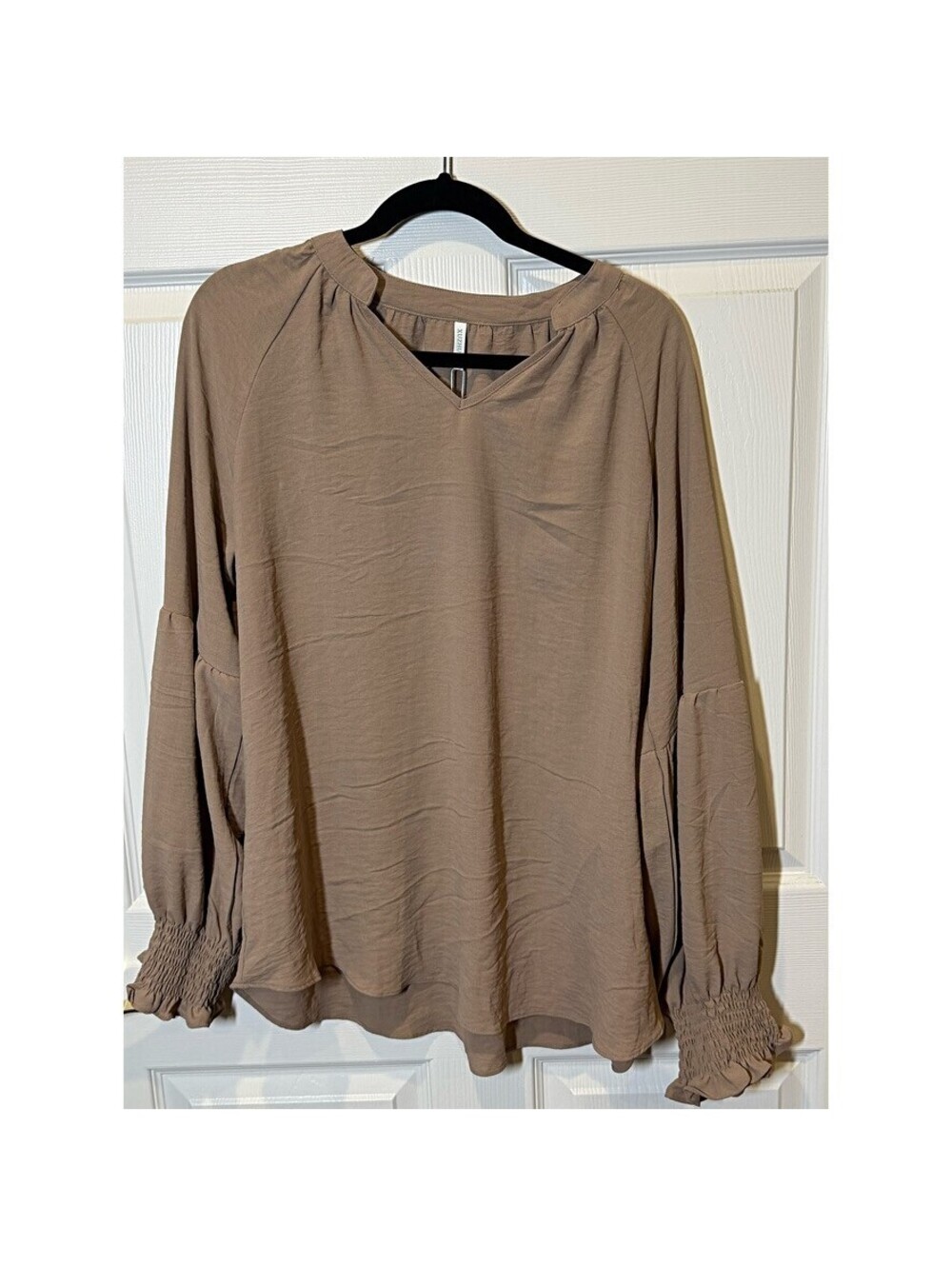 Blouse with smocked cuffs